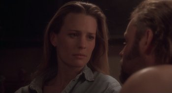 Movie still from “The Crossing Guard” (1995), directed by Sean Penn – A person looking at a mirror; Close Up shot, Over the shoulder angle