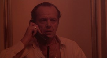 Movie still from “The Crossing Guard” (1995), directed by Sean Penn – An older man talking on a cell phone; Close Up shot, High angle