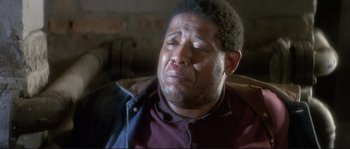 Movie still from “The Crying Game” (1992), directed by Neil Jordan – A person with a face covered in blood; Close Up shot, Low angle