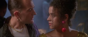 Movie still from “The Crying Game” (1992), directed by Neil Jordan – A man and a woman face to face in front of a mirror; Close Up shot, Over the shoulder angle