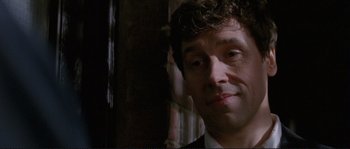 Movie still from “The Crying Game” (1992), directed by Neil Jordan – A man that is looking into the camera; Close Up shot, Low angle