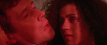 Movie still from “The Crying Game” (1992), directed by Neil Jordan – A man and a woman looking into each others eyes; Extreme Close Up shot, Low angle