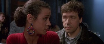 Movie still from “The Crying Game” (1992), directed by Neil Jordan – A man and a woman sitting next to each other; Close Up shot, Over the shoulder angle