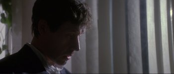 Movie still from “The Crying Game” (1992), directed by Neil Jordan – A man's face in the dark; Close Up shot, Low angle