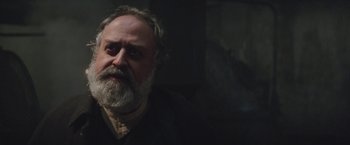 Movie still from “The Current War: Director's Cut” (2017), directed by Alfonso Gomez-Rejon – An old man with a beard and a goatee looking at the camera; Close Up shot, Low angle