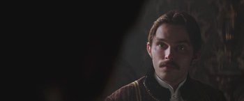 Movie still from “The Current War: Director's Cut” (2017), directed by Alfonso Gomez-Rejon – A person wearing a suit and tie; Close Up shot, Over the shoulder angle