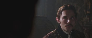 Movie still from “The Current War: Director's Cut” (2017), directed by Alfonso Gomez-Rejon – A person wearing a jacket; Close Up shot, Over the shoulder angle