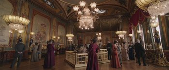 Movie still from “The Current War: Director's Cut” (2017), directed by Alfonso Gomez-Rejon – A group of people standing in a large room; Extreme Wide shot, High angle