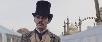 Movie still from “The Current War: Director's Cut” (2017), directed by Alfonso Gomez-Rejon – A man wearing a suit and a top hat; Close Up shot, Low angle