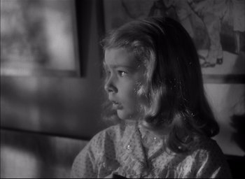 Movie still from “The Curse of the Cat People” (1944), directed by Robert Wise – A young girl is sitting in front of a mirror; Close Up shot, High angle