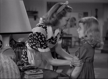Movie still from “The Curse of the Cat People” (1944), directed by Robert Wise – An older woman and a young girl in a room; Medium shot, Over the shoulder angle