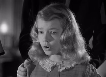 Movie still from “The Curse of the Cat People” (1944), directed by Robert Wise – A little girl with long blonde curly hair; Close Up shot, High angle