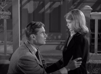 Movie still from “The Curse of the Cat People” (1944), directed by Robert Wise – A man and a woman are looking at one another; Medium shot, Low angle