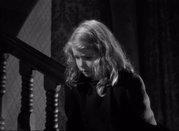 Movie still from “The Curse of the Cat People” (1944), directed by Robert Wise – A young girl standing at the top of a staircase; Close Up shot, High angle