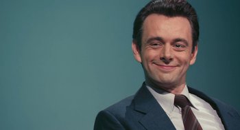 Movie still from “The Damned United” (2009), directed by Tom Hooper – A person wearing a suit and tie; Close Up shot, Low angle