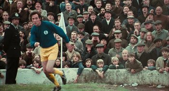 Movie still from “The Damned United” (2009), directed by Tom Hooper – A crowd of people watching a soccer game; Wide shot, High angle