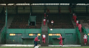 Movie still from “The Damned United” (2009), directed by Tom Hooper – A group of men playing a game of soccer; Extreme Wide shot, High angle