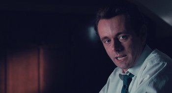Movie still from “The Damned United” (2009), directed by Tom Hooper – A person wearing a shirt and a tie; Close Up shot, Low angle