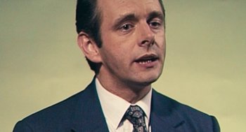 Movie still from “The Damned United” (2009), directed by Tom Hooper – A person wearing a suit and tie; Close Up shot, High angle