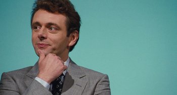 Movie still from “The Damned United” (2009), directed by Tom Hooper – A person wearing a suit and tie; Close Up shot, Over the shoulder angle