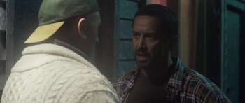 Movie still from “The Dark Horse” (2014), directed by James Napier Robertson – A man in a plaid shirt talking to another man in a plaid shirt; Close Up shot, Over the shoulder angle