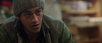 Movie still from “The Dark Horse” (2014), directed by James Napier Robertson – A person wearing a jacket and a hat; Close Up shot, Over the shoulder angle