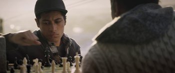 Movie still from “The Dark Horse” (2014), directed by James Napier Robertson – A man sitting in front of a chess board; Close Up shot, Over the shoulder angle