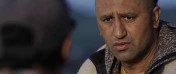 Movie still from “The Dark Horse” (2014), directed by James Napier Robertson – A person looking at another person; Close Up shot, Over the shoulder angle