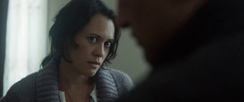 Movie still from “The Dark Horse” (2014), directed by James Napier Robertson – A woman sitting in front of another person; Close Up shot, Over the shoulder angle