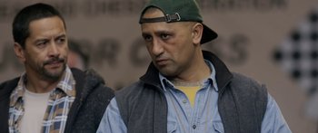 Movie still from “The Dark Horse” (2014), directed by James Napier Robertson – A person wearing a hat; Close Up shot, Over the shoulder angle