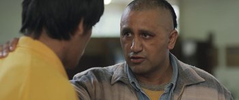 Movie still from “The Dark Horse” (2014), directed by James Napier Robertson – A person talking to another person; Close Up shot, Over the shoulder angle