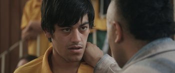 Movie still from “The Dark Horse” (2014), directed by James Napier Robertson – A young man is looking at another young man; Close Up shot, Over the shoulder angle