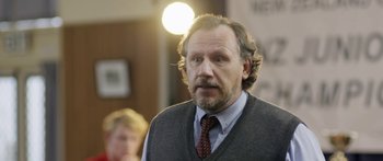 Movie still from “The Dark Horse” (2014), directed by James Napier Robertson – A person wearing a tie; Close Up shot, Over the shoulder angle