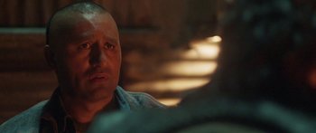 Movie still from “The Dark Horse” (2014), directed by James Napier Robertson – A man's face in the dark; Close Up shot, Over the shoulder angle