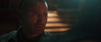 Movie still from “The Dark Horse” (2014), directed by James Napier Robertson – A man's face in a dimly - lit room; Close Up shot, Over the shoulder angle