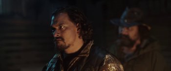 Movie still from “The Dark Horse” (2014), directed by James Napier Robertson – A person wearing a jacket; Close Up shot, Over the shoulder angle