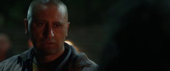 Movie still from “The Dark Horse” (2014), directed by James Napier Robertson – A person wearing a hooded sweatshirt; Close Up shot, Over the shoulder angle