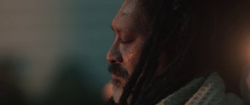 Movie still from “The Dark Horse” (2014), directed by James Napier Robertson – A person with dreadlocks; Extreme Close Up shot, Low angle