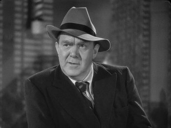 Movie still from “The Dark Mirror” (1946), directed by Robert Siodmak – An older man wearing a suit and a hat; Close Up shot, Over the shoulder angle
