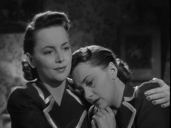 Movie still from “The Dark Mirror” (1946), directed by Robert Siodmak – A couple of women sitting next to each other; Close Up shot, High angle