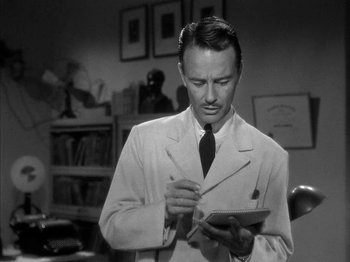 Movie still from “The Dark Mirror” (1946), directed by Robert Siodmak – A black and white photo of a man in a lab coat; Close Up shot, Low angle
