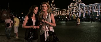 Movie still from “The Darkest Hour” (2011), directed by Chris Gorak – Two beautiful young women standing next to each other; Medium shot, Low angle