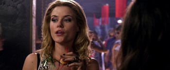 Movie still from “The Darkest Hour” (2011), directed by Chris Gorak – A beautiful woman holding a hot dog in her hand; Close Up shot, Over the shoulder angle