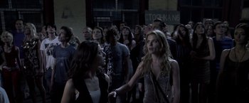 Movie still from “The Darkest Hour” (2011), directed by Chris Gorak – A group of people standing in front of each other; Medium shot, Over the shoulder angle