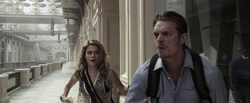 Movie still from “The Darkest Hour” (2011), directed by Chris Gorak – A man and a woman walking down a street; Close Up shot, Low angle