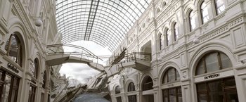 Movie still from “The Darkest Hour” (2011), directed by Chris Gorak – A building that has been destroyed by a fire; Extreme Wide shot, Low angle