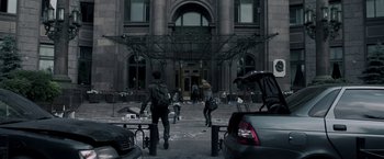 Movie still from “The Darkest Hour” (2011), directed by Chris Gorak – A group of people walking down a street; Wide shot, Low angle