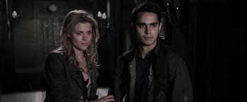 Movie still from “The Darkest Hour” (2011), directed by Chris Gorak – A man and a woman standing next to each other; Close Up shot, Low angle