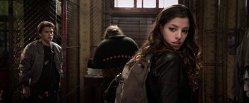 Movie still from “The Darkest Hour” (2011), directed by Chris Gorak – A woman with a backpack standing in front of another woman; Close Up shot, Over the shoulder angle