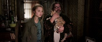 Movie still from “The Darkest Hour” (2011), directed by Chris Gorak – A man and a woman holding a cat in their hands; Medium shot, Over the shoulder angle